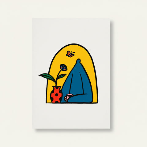 Colorful abstract drawing on a white sheet of paper placed on a wooden table.