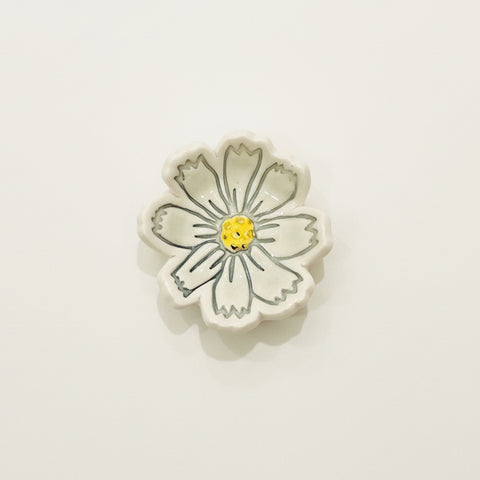Flower-shaped object on a wooden surface