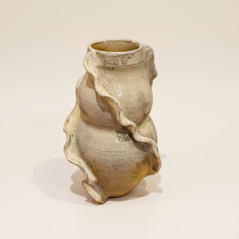 Decorative vase on a white surface.