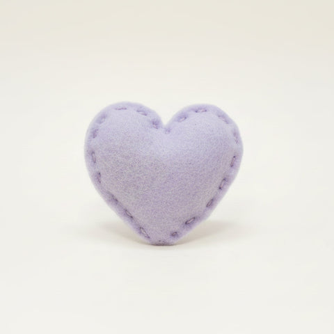 Heart-shaped lavender catnip toy on a white background