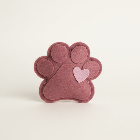 Catnip toy in a clear bag with a label on a textured surface