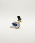 Small figurine of a bird wearing a top hat
