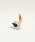 Decorative ceramic bird figurine with a colorful party hat