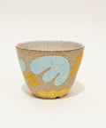 Decorative ceramic planter pot with abstract pattern.