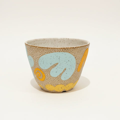 Decorative ceramic planter pot with abstract pattern.