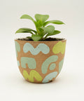 Ceramic planter pot with abstract patterns