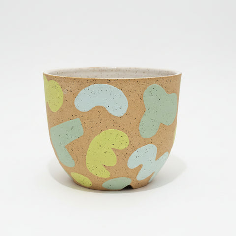 Ceramic planter pot with an abstract pattern.