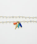 necklace with charms on a wooden surface
