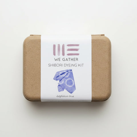 Shibori dyeing kit with a label on a wooden surface