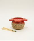 Red flower-shaped match holder