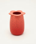 Red flower-shaped vase.