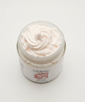 Jar of white powder with 'yahlistic' branding on a wooden surface