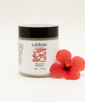 Yahlistic body butter jar on a wooden surface