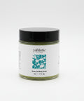 Jar of yahlistic Green Tea Body Scrub on a wooden surface