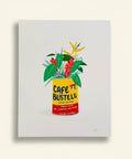 Cafe Bustelo coffee can with plants on a white background