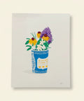 Art print of a blue floral cup with flowers on a wooden surface