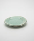 Small ceramic plate on a wooden surface