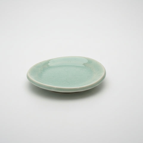 Small ceramic plate on a wooden surface