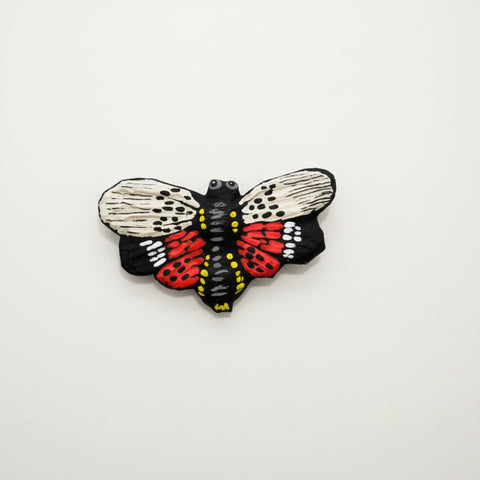Colorful lantern fly-shaped wall art
