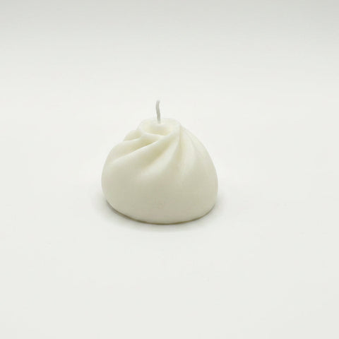 White candle on a white background