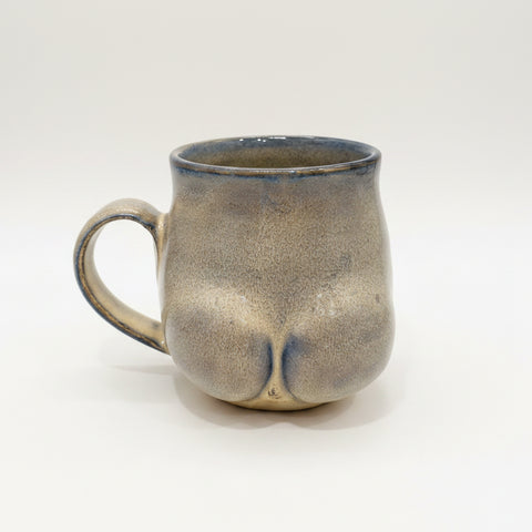 Ceramic mug with a unique design on a wooden surface