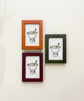 Three framed illustrations of a bowl with a spoon on a wooden surface