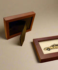 Wooden picture frames on a wooden table with a store interior in the background