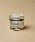 Jar of Ahmesa product on a wooden counter