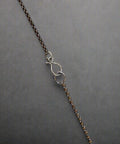 Necklace with a clasp on a wooden surface