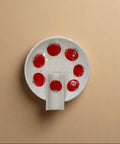 White ceramic ashtray with tomato pattern