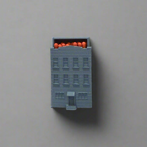 3d printed match holder shaped like a brownstone