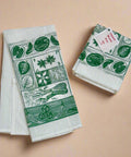 Set of two green and white patterned towels