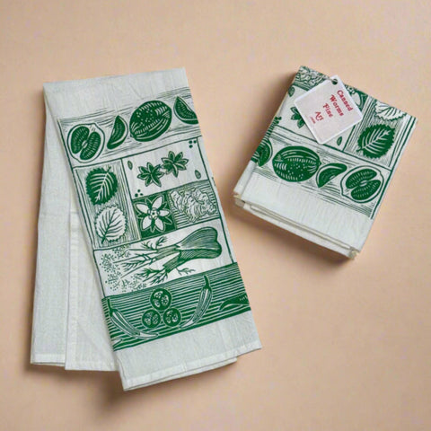 Set of two green and white patterned towels