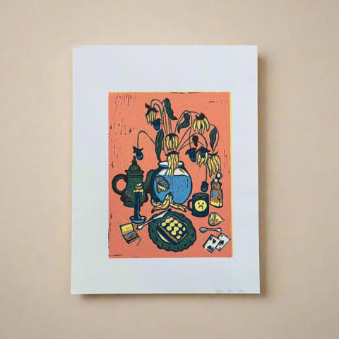 Art print of a still life scene with a teapot and flowers on a wooden surface.