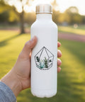 A die-cut sticker featuring a hand-drawn geometric terrarium with succulents, placed on a light wood surface.