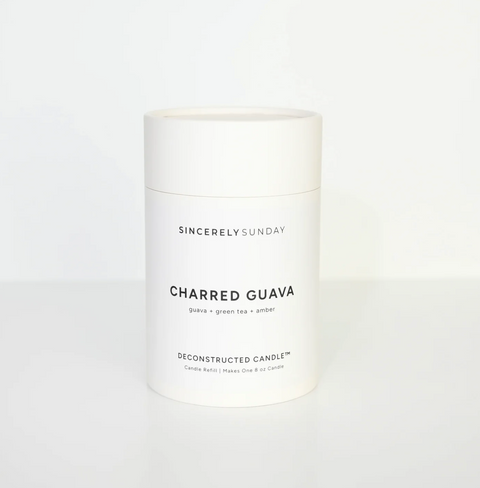 White candle jar labeled 'Charred Guava' by Sincerely Sunday on a white background