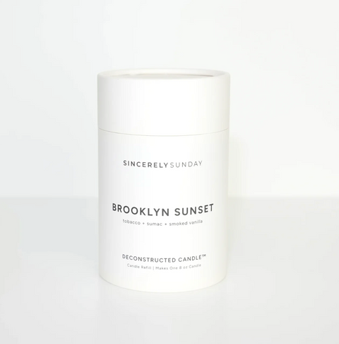 Candle jar labeled 'Brooklyn Sunset' by Sincerely Sunday on a white background