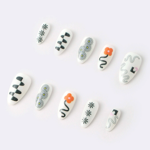 Set of white nail art designs on a white background