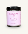 Jar of 'Fairy Rosy' herbal bath soak on a pink and white checkered background