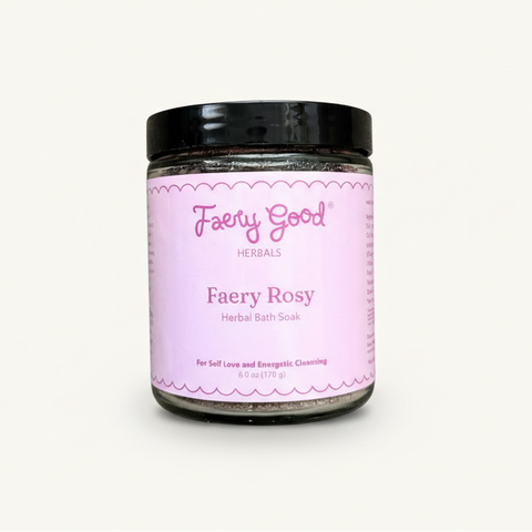 Jar of 'Fairy Rosy' herbal bath soak on a pink and white checkered background