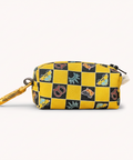 Yellow and black checkered pouch with cartoon character designs on a wooden surface