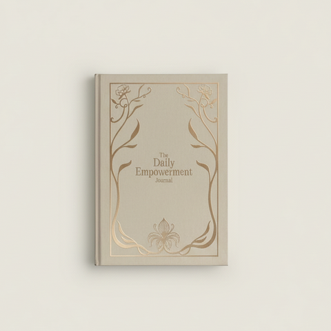 Beige journal titled 'The Daily Empowerment Journal' with decorative elements on a light gray background