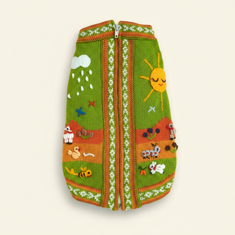 Knitted pet sweater with colorful patterns on a white background