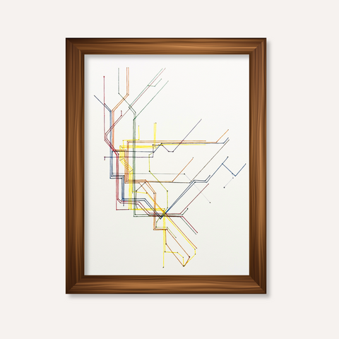 Framed abstract transit map art print with multicolored intersecting lines on a white background, enclosed in a medium brown wood frame against a light beige wall.