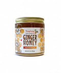 Jar of Honey Granz Creamed Ginger Honey on a white background