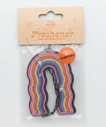 Air freshener with rainbow design on a blue background