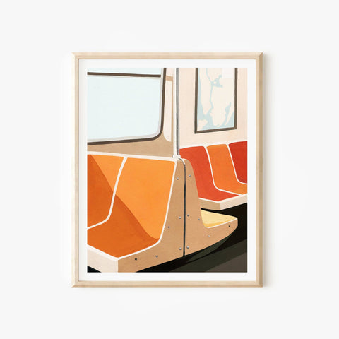 Framed artwork of a train interior with orange seats on a white background