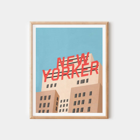 Framed artwork with 'New Yorker' text on a building against a blue sky.