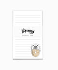 Notepad with an illustration of a dog holding a bagel in the bottom right corner.