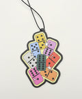 Colorful domino-shaped keychain on a blue background